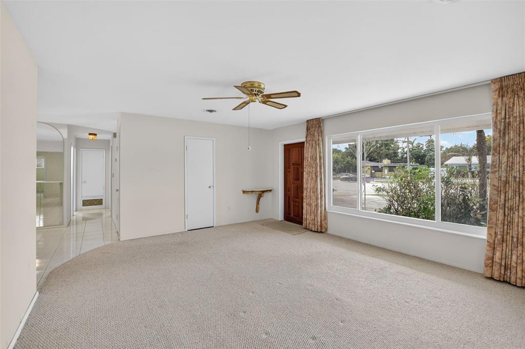 450 Northwest 12th Avenue Boca Raton, FL 33486 - Photo 9 of 58 a view of a livingroom with a ceiling fan and window
