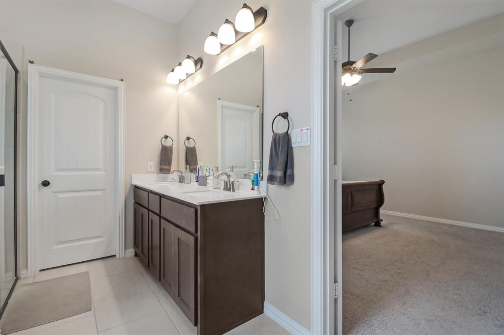 189 Chester Road Springtown, TX 76082 - Photo 20 of 29 a bathroom with a sink vanity and a mirror