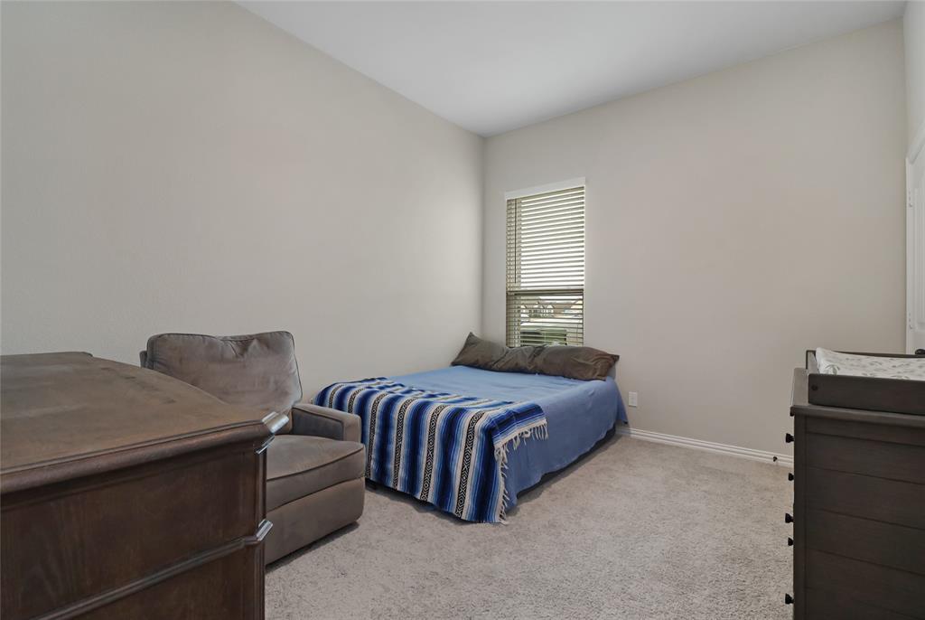 189 Chester Road Springtown, TX 76082 - Photo 21 of 29 a bedroom with a bed and a window
