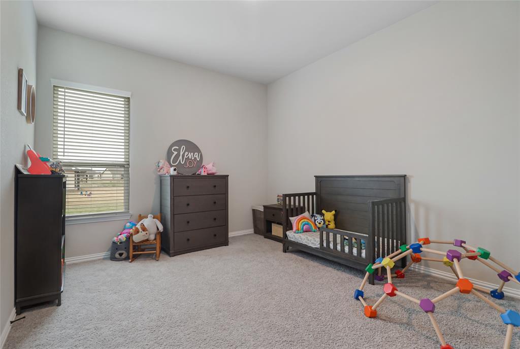189 Chester Road Springtown, TX 76082 - Photo 23 of 29 a children room with toys and a couch