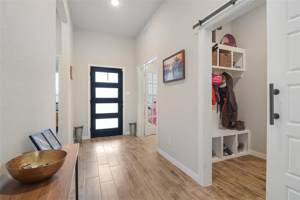 189 Chester Road Springtown, TX 76082 - Photo 3 of 29 a view of a livingroom with wooden floor and windows