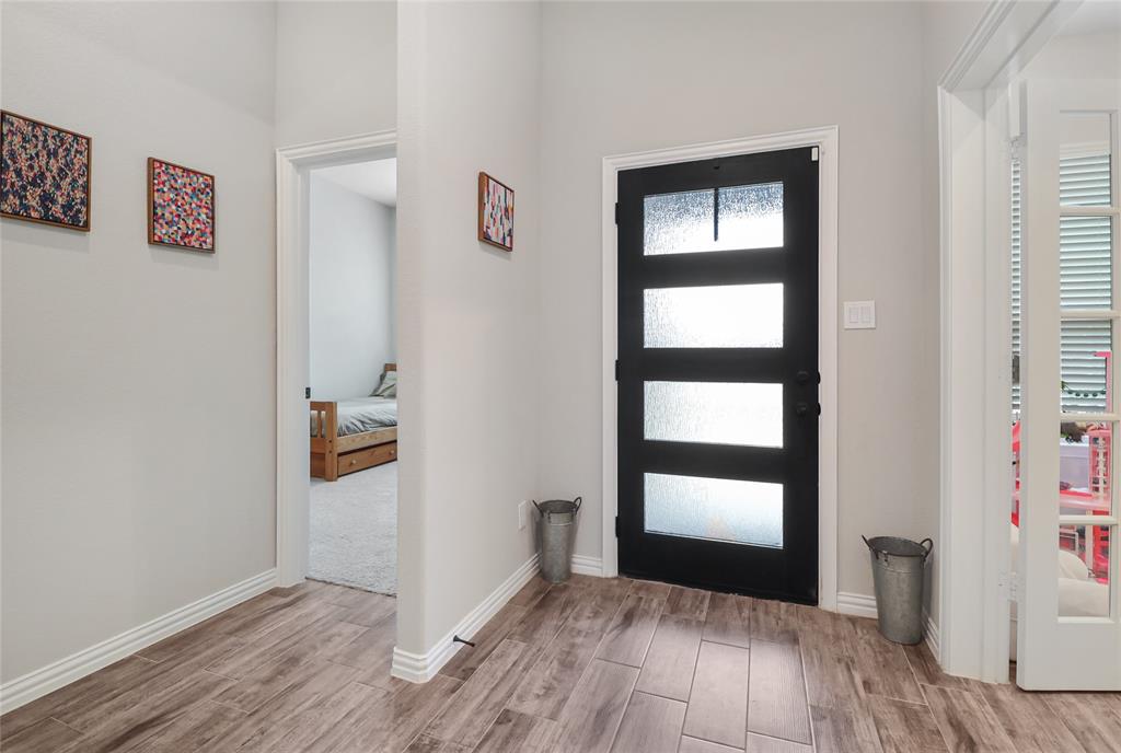 189 Chester Road Springtown, TX 76082 - Photo 4 of 29 a view of empty room with wooden floor