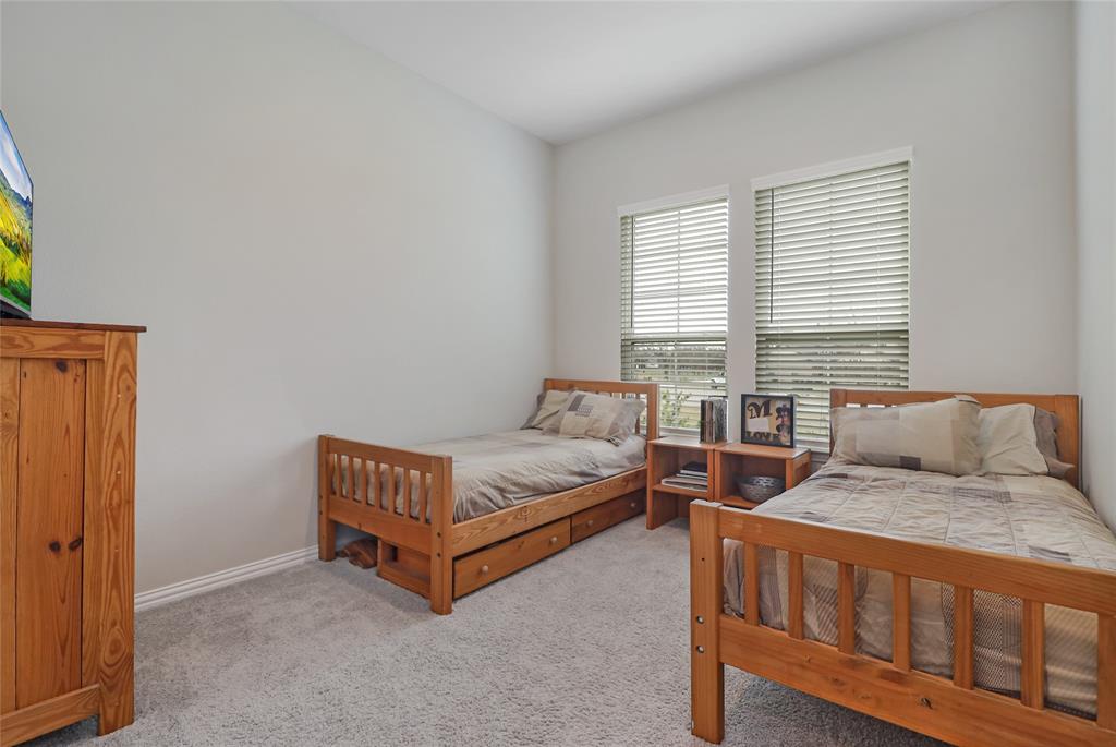 189 Chester Road Springtown, TX 76082 - Photo 7 of 29 a spacious bedroom with a bed and a window