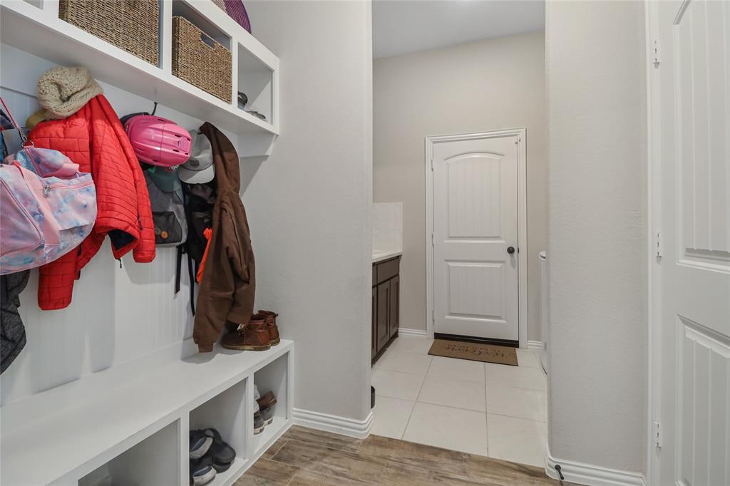 189 Chester Road Springtown, TX 76082 - Photo 9 of 29 a view of walk in closet with clothes and shoes