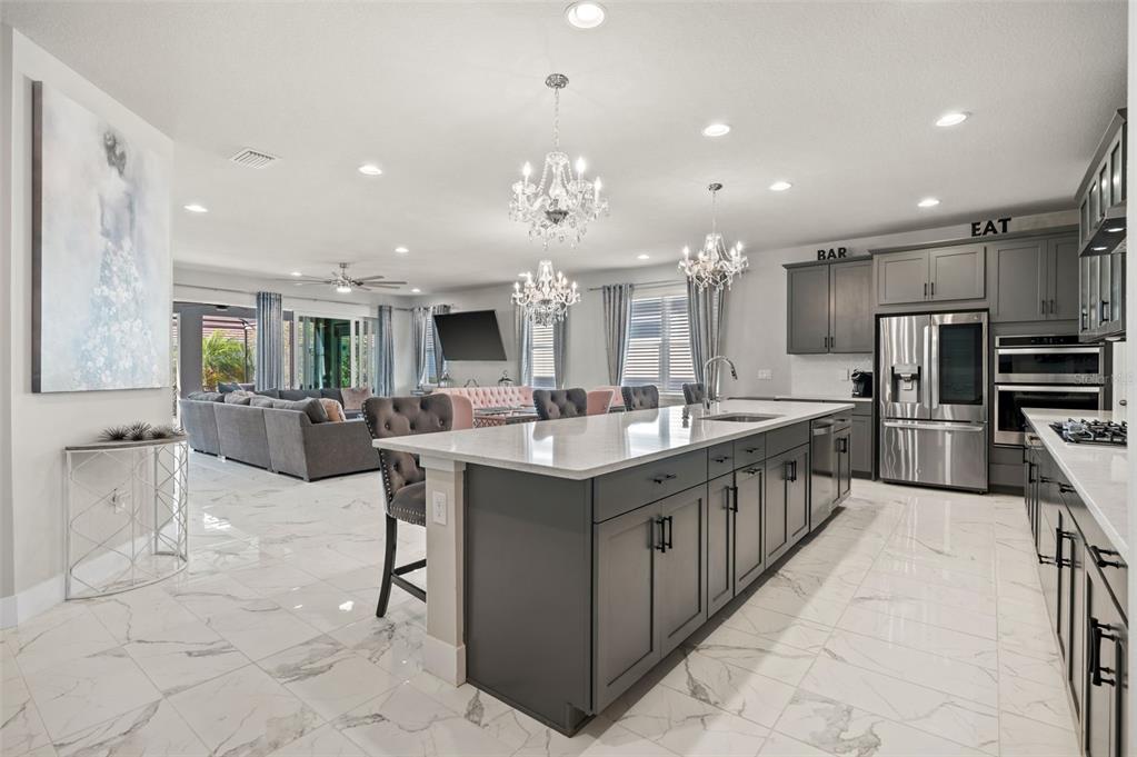 5632 Long Shore Loop Sarasota, FL 34238 - Photo 13 of 56 a kitchen with counter top space appliances and cabinets