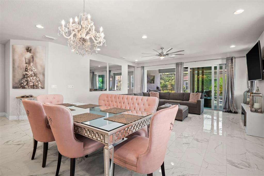 5632 Long Shore Loop Sarasota, FL 34238 - Photo 15 of 56 a view of a dining room with furniture a livingroom and chandelier