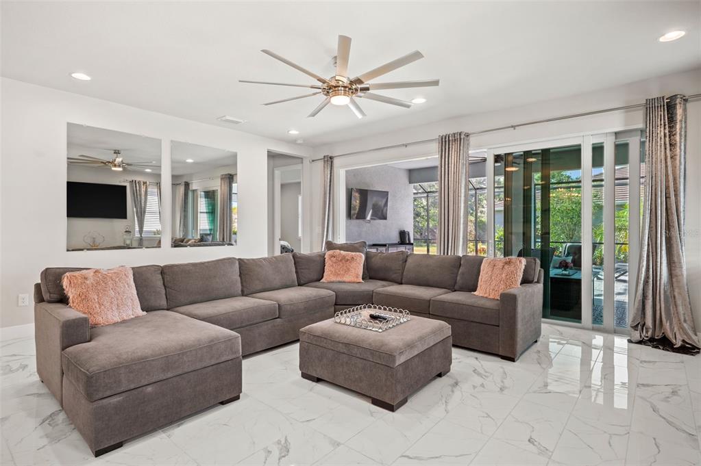 5632 Long Shore Loop Sarasota, FL 34238 - Photo 16 of 56 a living room with furniture and a large window
