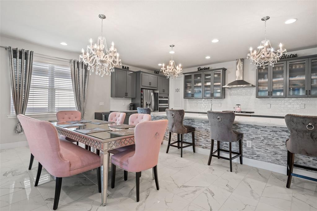 5632 Long Shore Loop Sarasota, FL 34238 - Photo 19 of 56 a dining room with furniture and chandelier