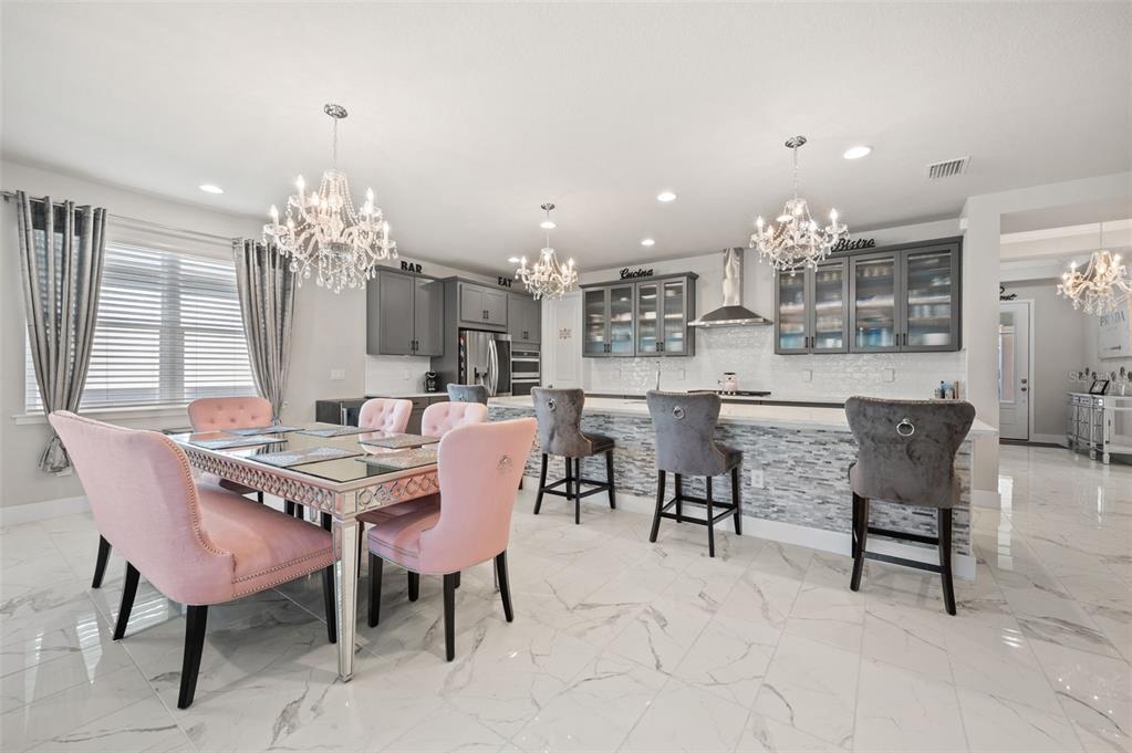 5632 Long Shore Loop Sarasota, FL 34238 - Photo 20 of 56 a dining room with furniture and chandelier