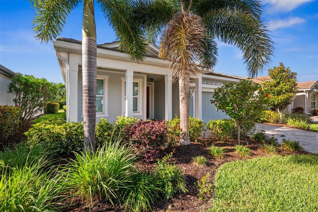 5632 Long Shore Loop Sarasota, FL 34238 - Photo 2 of 56 front view of a house with a yard