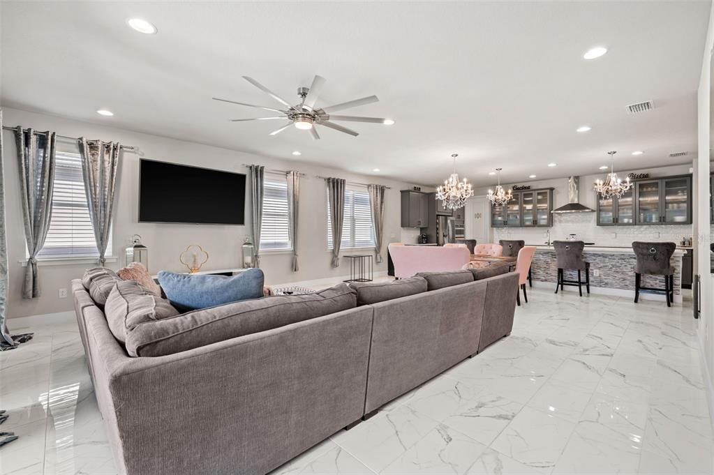 5632 Long Shore Loop Sarasota, FL 34238 - Photo 21 of 56 a living room with furniture and a flat screen tv