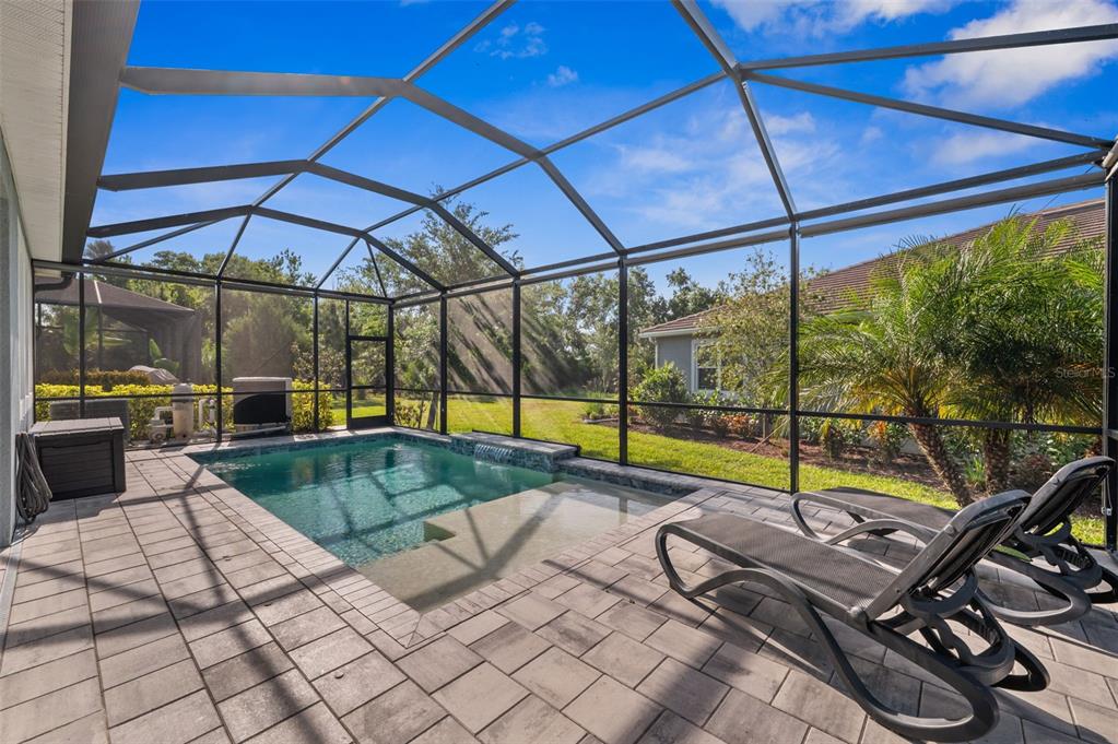 5632 Long Shore Loop Sarasota, FL 34238 - Photo 29 of 56 a view of a swimming pool with a lounge chair
