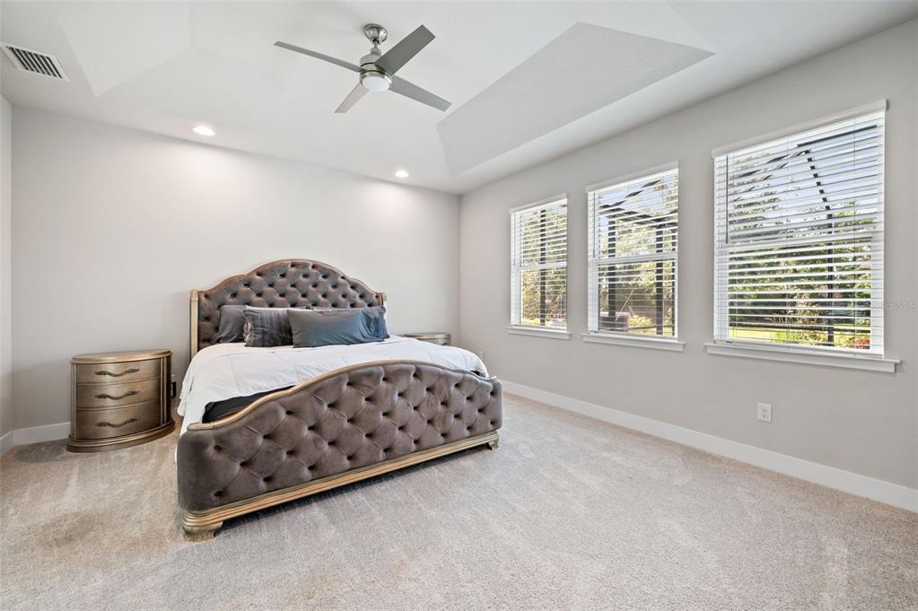 5632 Long Shore Loop Sarasota, FL 34238 - Photo 34 of 56 a bedroom with a bed and a window