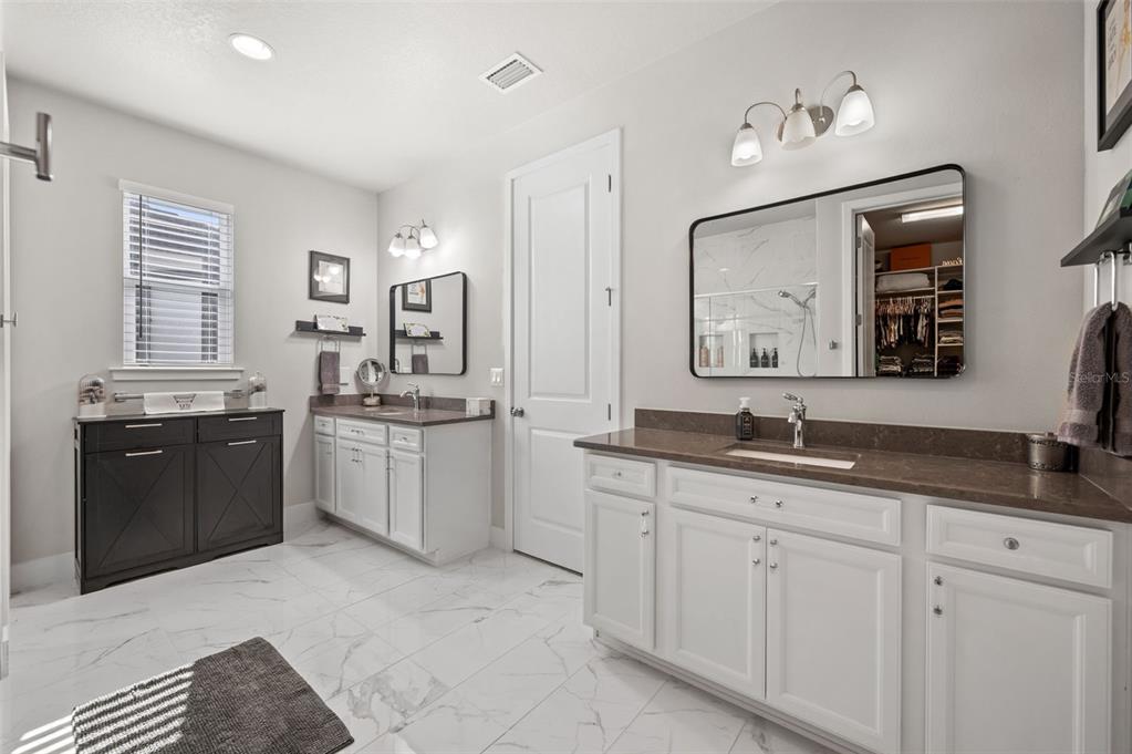 5632 Long Shore Loop Sarasota, FL 34238 - Photo 36 of 56 a spacious bathroom with a double vanity sink double and mirror