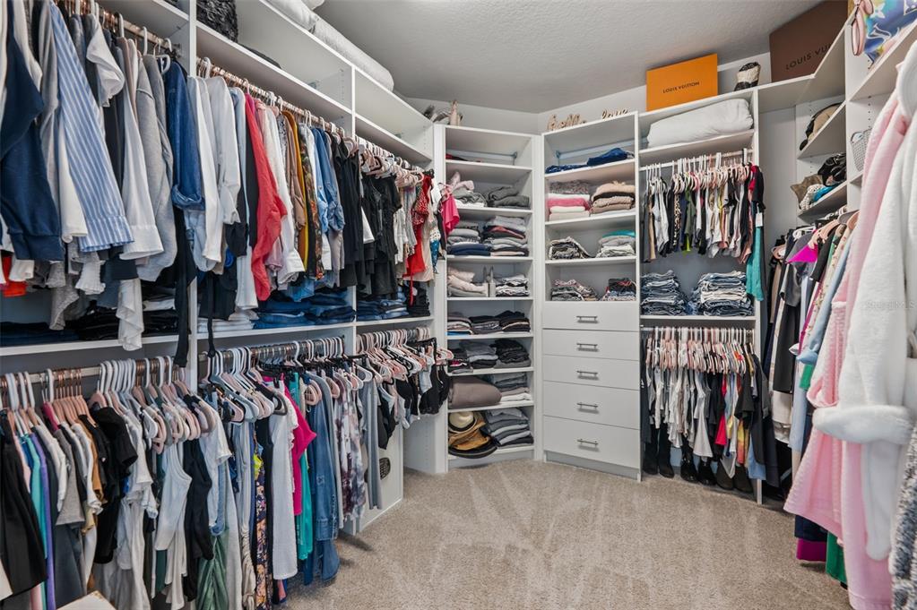 5632 Long Shore Loop Sarasota, FL 34238 - Photo 42 of 56 a view of walk in closet with clothes and shoes