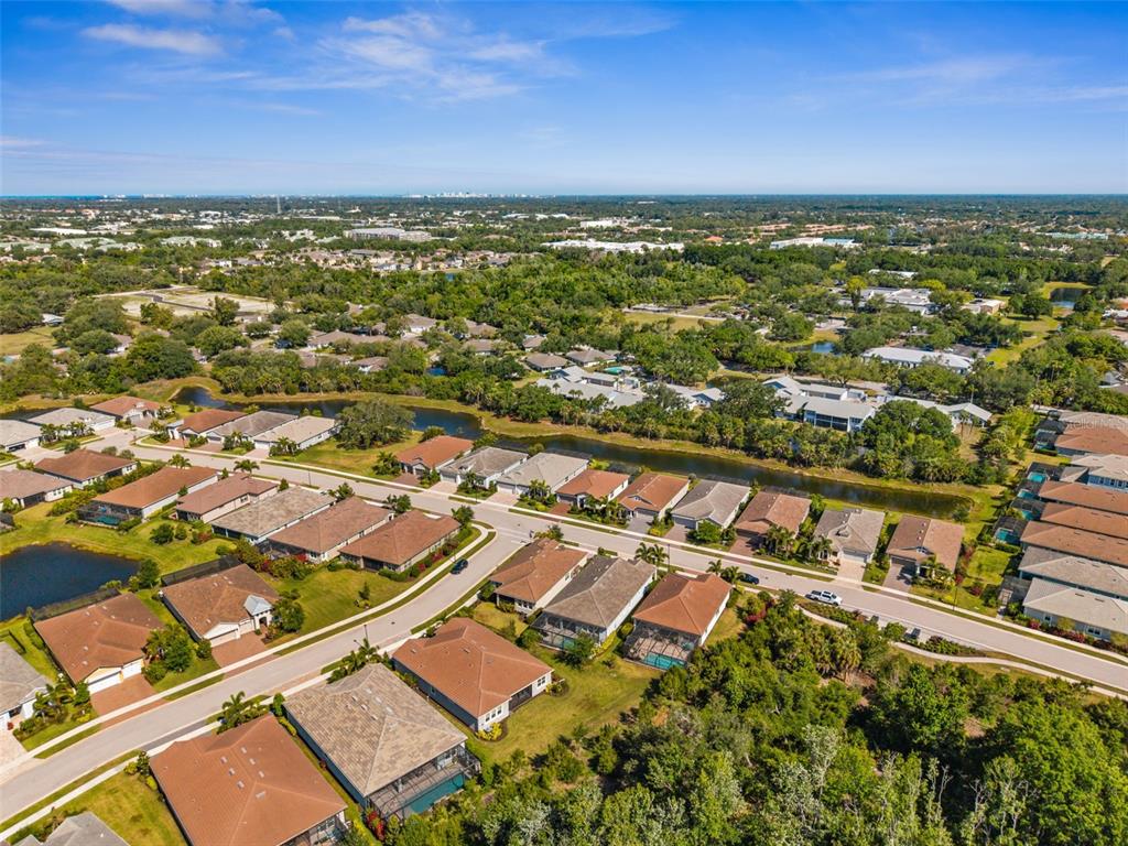 5632 Long Shore Loop Sarasota, FL 34238 - Photo 50 of 56 an aerial view of residential building and lake