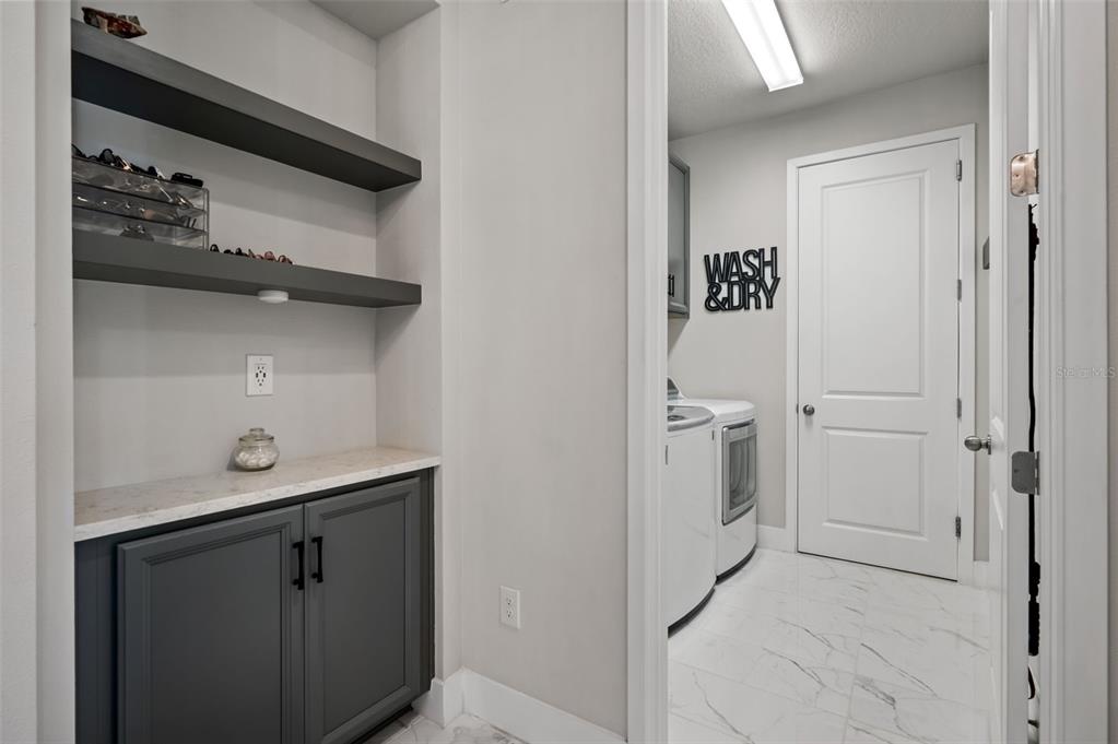 5632 Long Shore Loop Sarasota, FL 34238 - Photo 6 of 56 a bathroom with a sink and a mirror