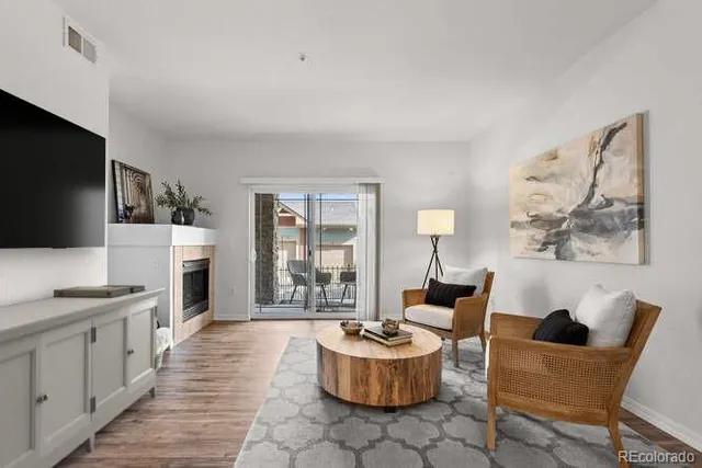 a view of a dining room with furniture wooden floor and a chandelier