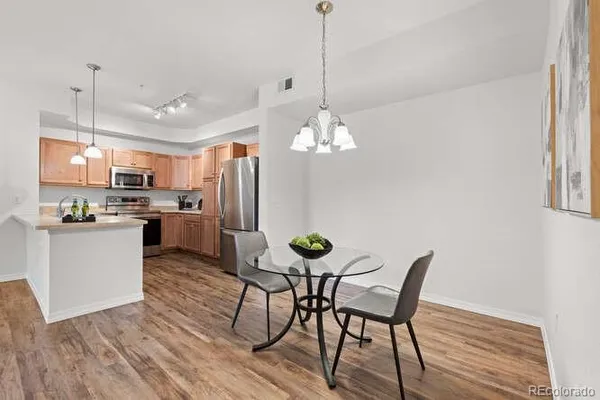 a view of a dining room with furniture and wooden floor