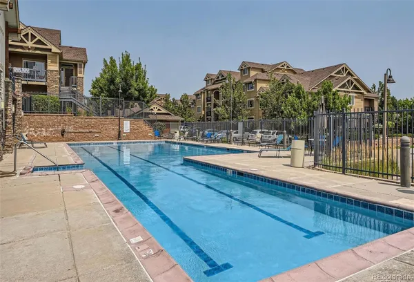 a view of a swimming pool with a patio