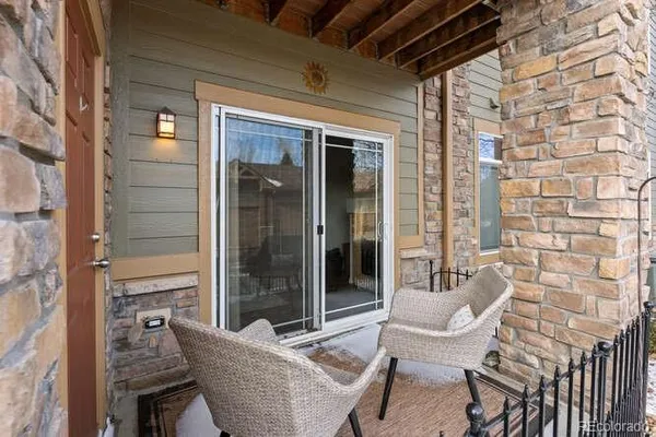 a view of two chairs in the balcony