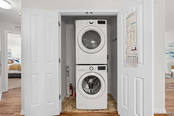 a view of a hallway with washer and dryer