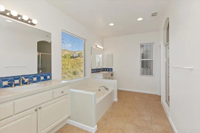 a bathroom with a bathtub and a sink