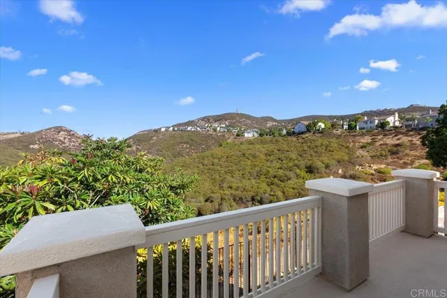 a view of a balcony with an outdoor space and seating