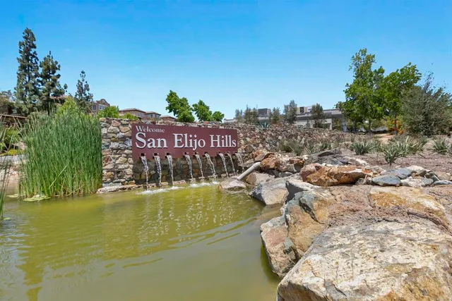 a view of a swimming pool with a balcony