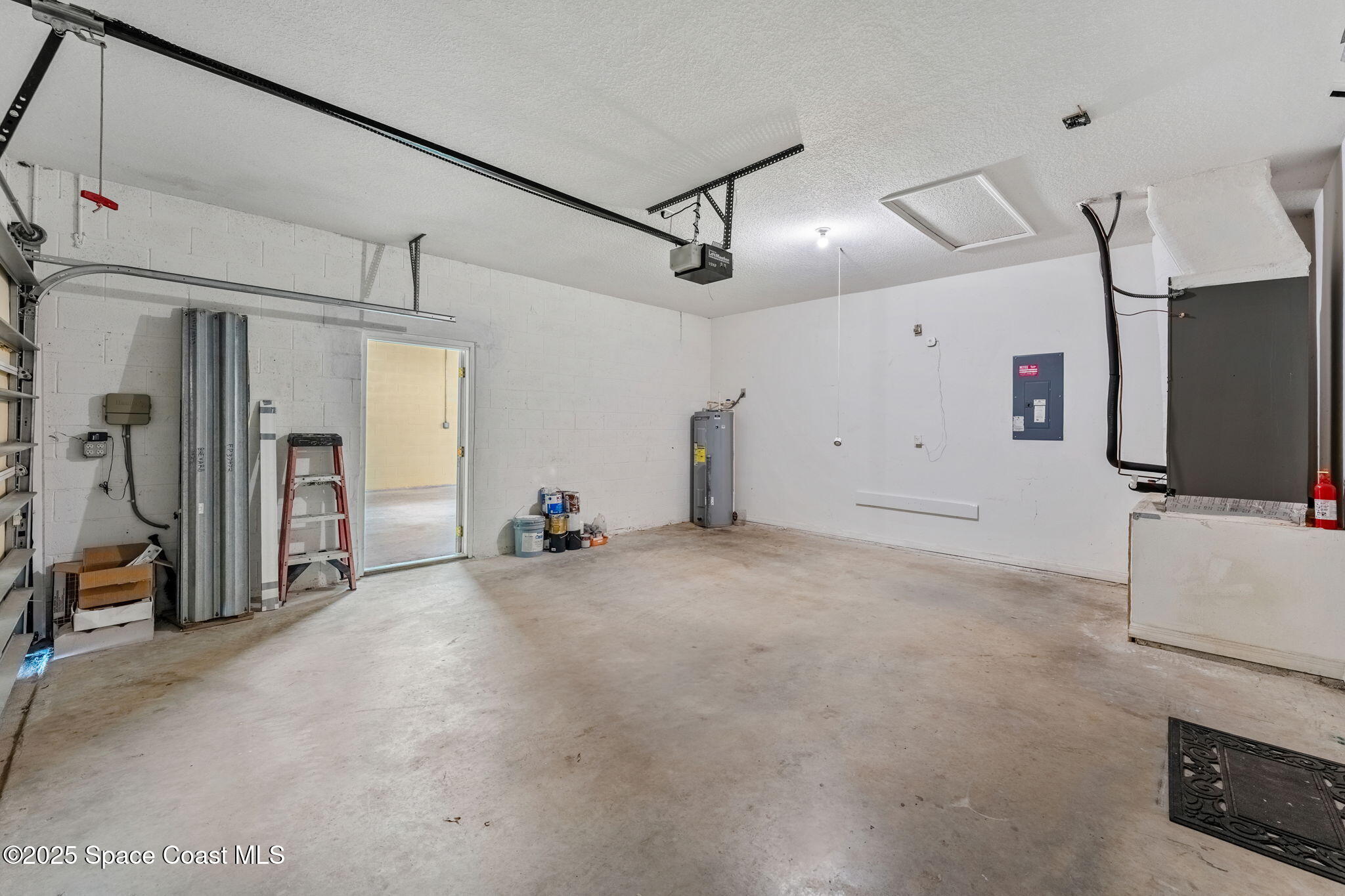 1385 Friday Road Cocoa, FL 32926 - Photo 24 of 33 a view of a livingroom with furniture and a refrigerator