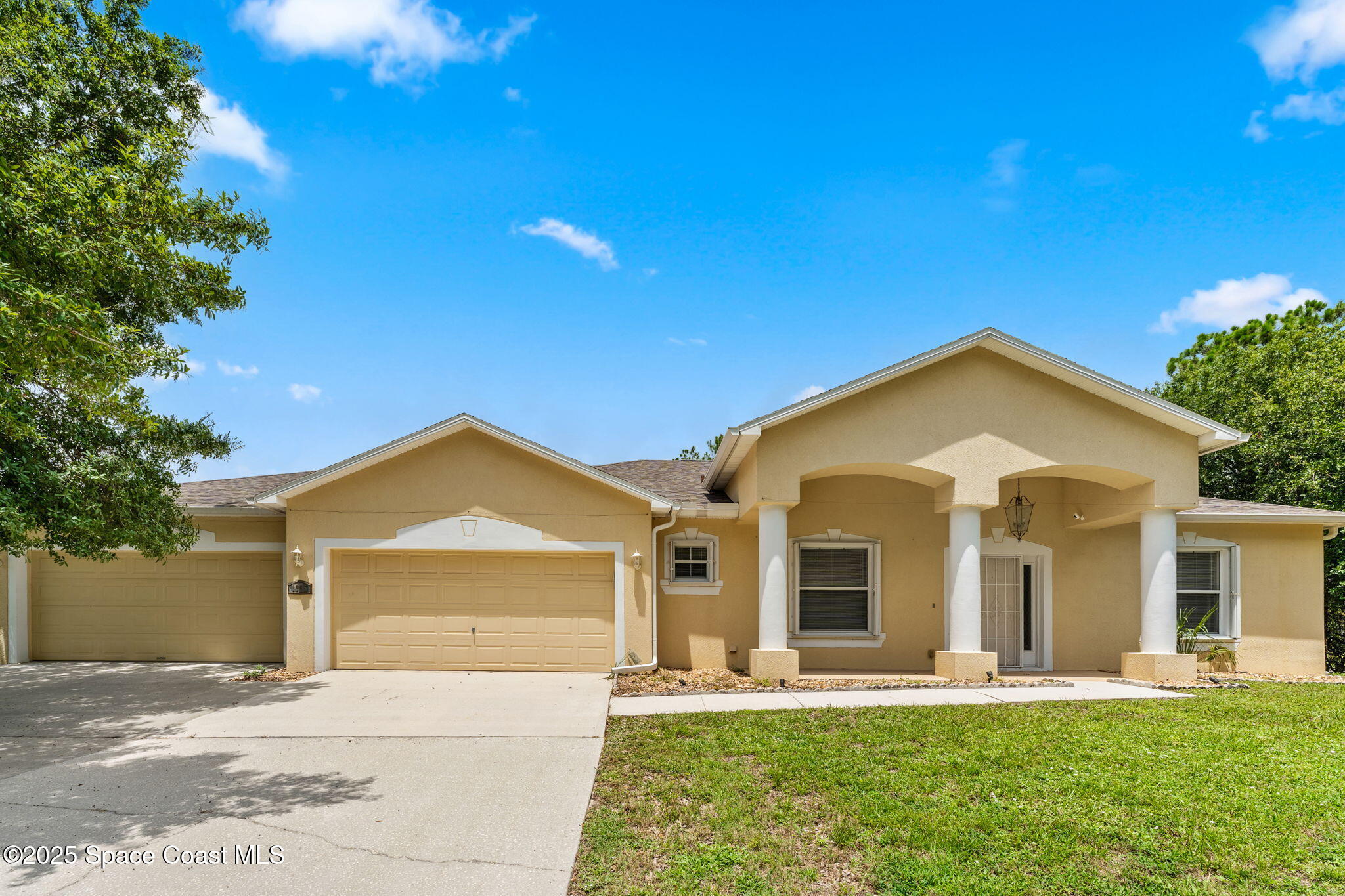 1385 Friday Road Cocoa, FL 32926 - Photo 4 of 33 a front view of a house with a yard