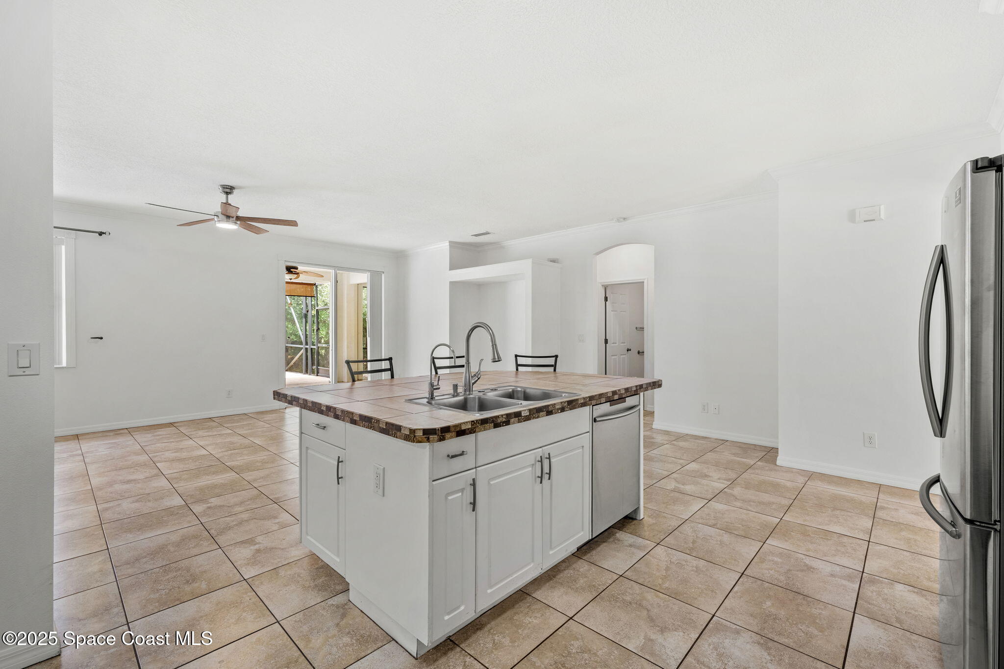 1385 Friday Road Cocoa, FL 32926 - Photo 8 of 33 a kitchen with a sink and cabinets