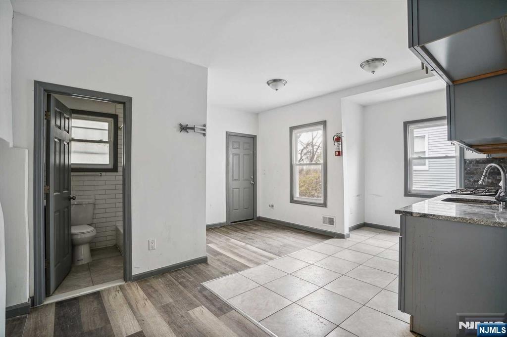143 Valley Road, Unit 1R Montclair, NJ 07042 - Photo 4 of 18 a view of a kitchen with fridge and window
