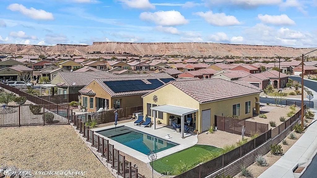 1304 Cottage Ridge Mesquite, NV 89034 - Photo 43 of 52 An inviting pool, private patio, and putting green await in this desert oasis.