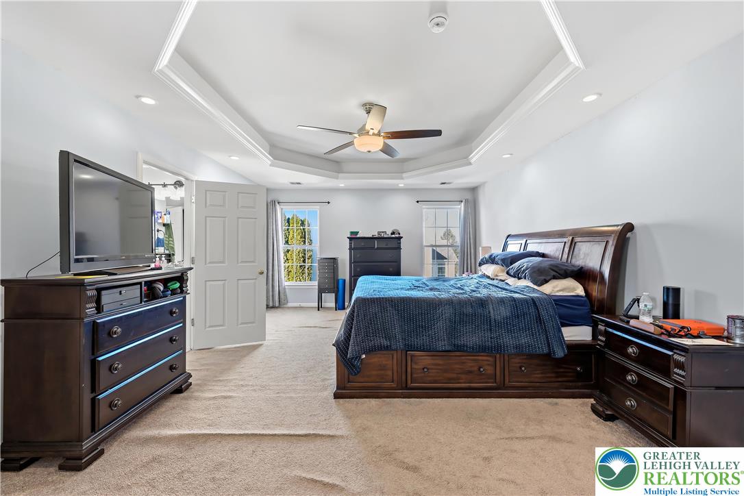 130 Lower Way Road Easton, PA 18045 - Photo 21 of 56 a spacious bedroom with a bed and a flat screen tv