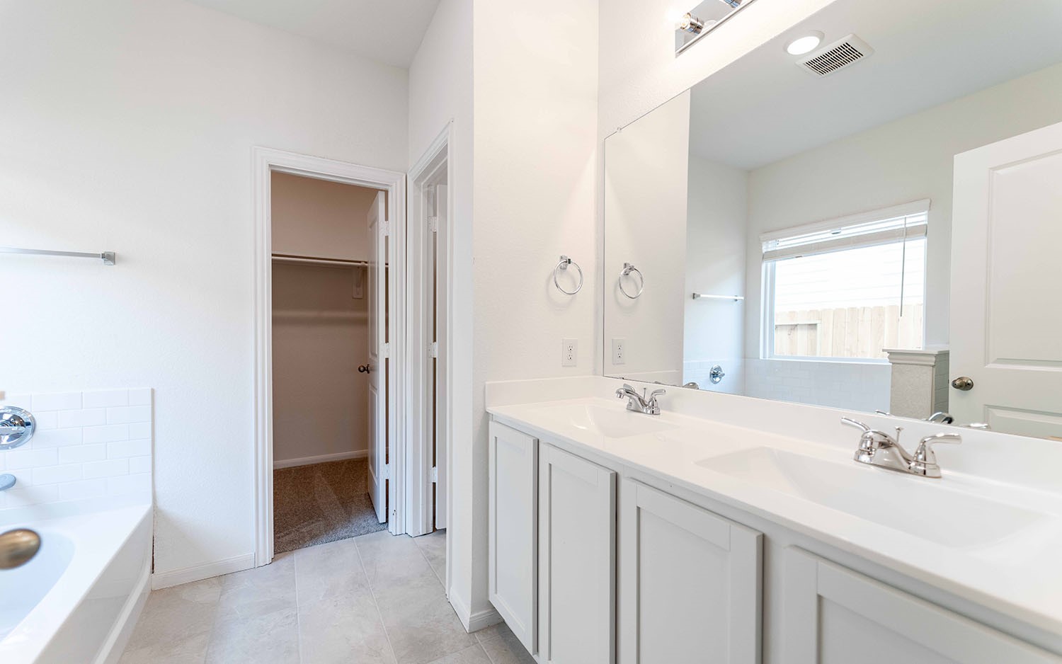 427 Monarch Trail Huntsville, TX 77340 - Photo 11 of 18 a bathroom with a sink a vanity and a mirror