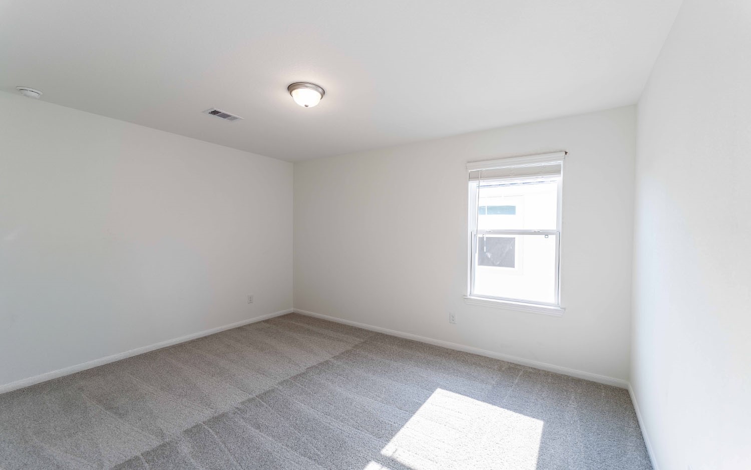 427 Monarch Trail Huntsville, TX 77340 - Photo 14 of 18 an empty room with a window