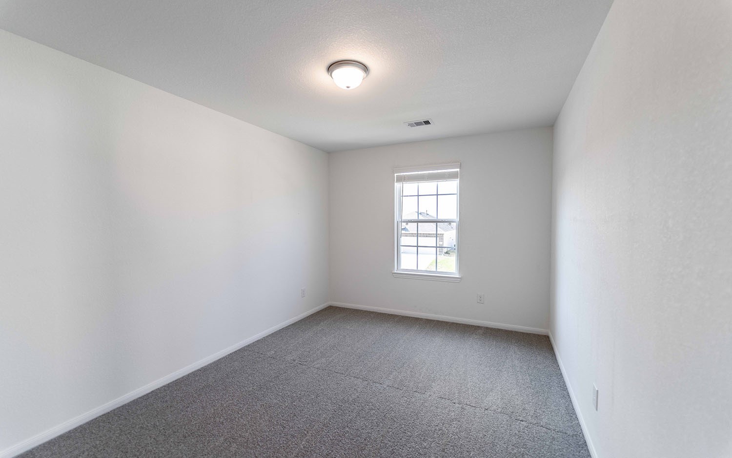 427 Monarch Trail Huntsville, TX 77340 - Photo 16 of 18 an empty room with a window