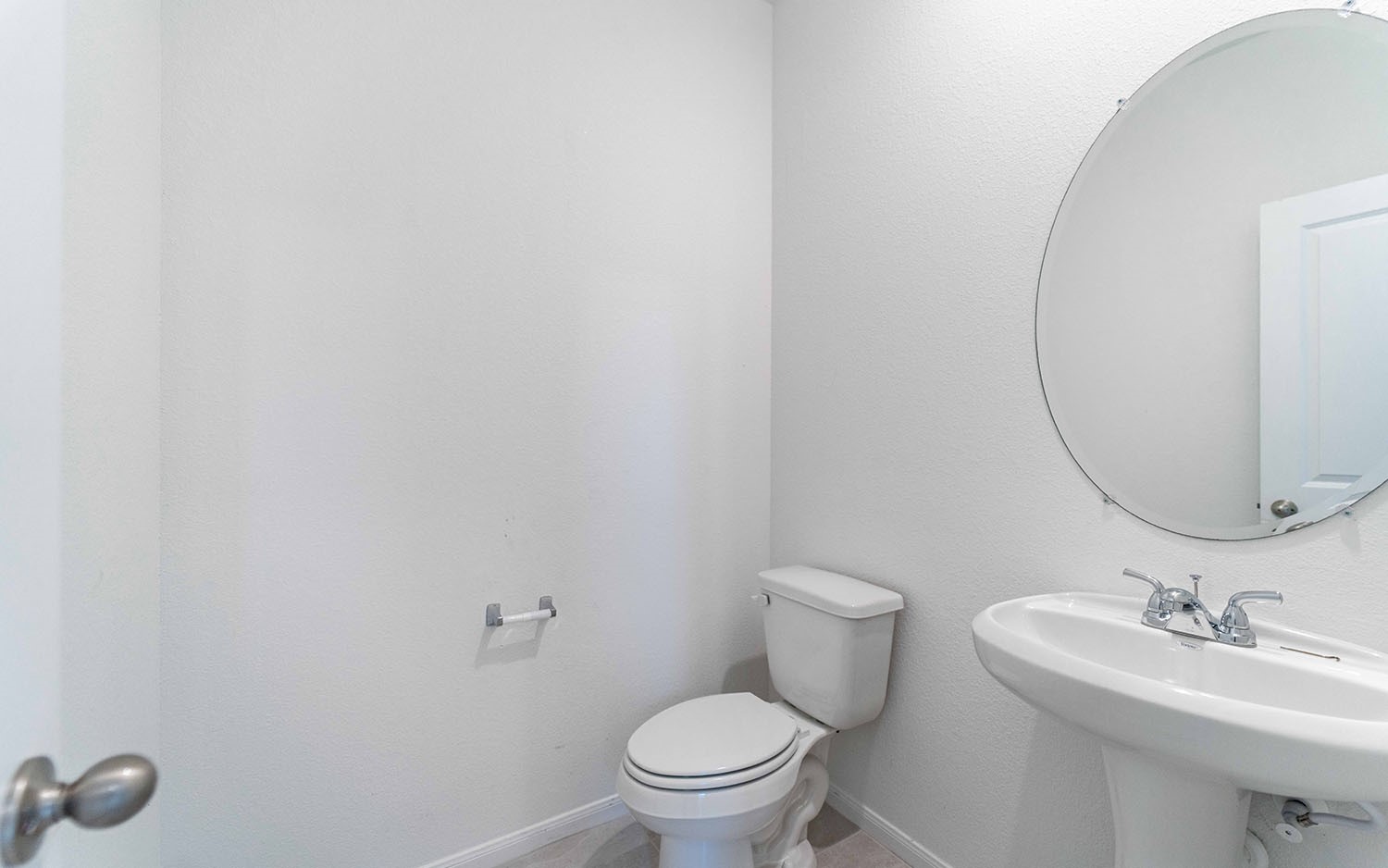 427 Monarch Trail Huntsville, TX 77340 - Photo 17 of 18 a bathroom with a sink a toilet and a mirror