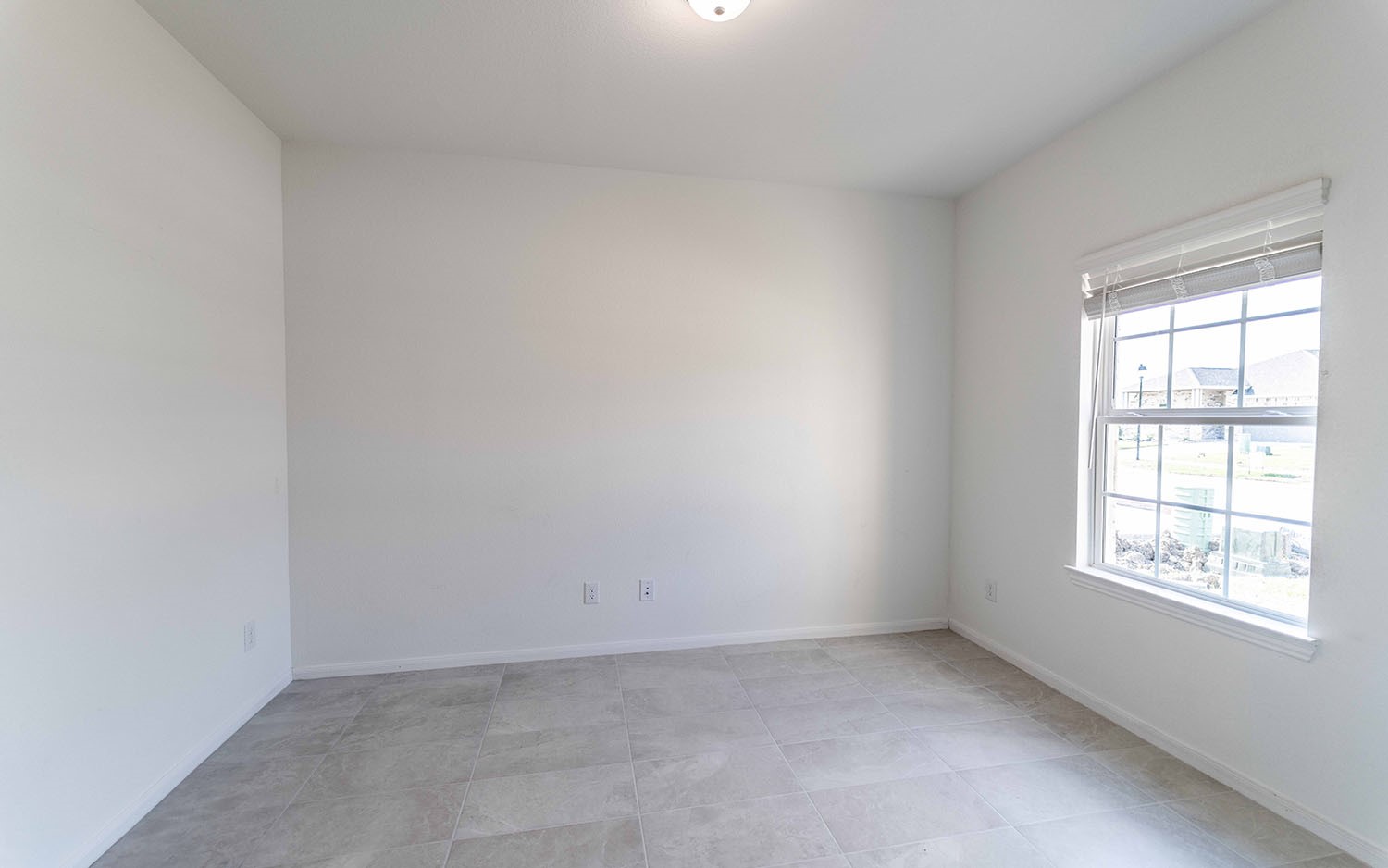 427 Monarch Trail Huntsville, TX 77340 - Photo 2 of 18 an empty room with a window