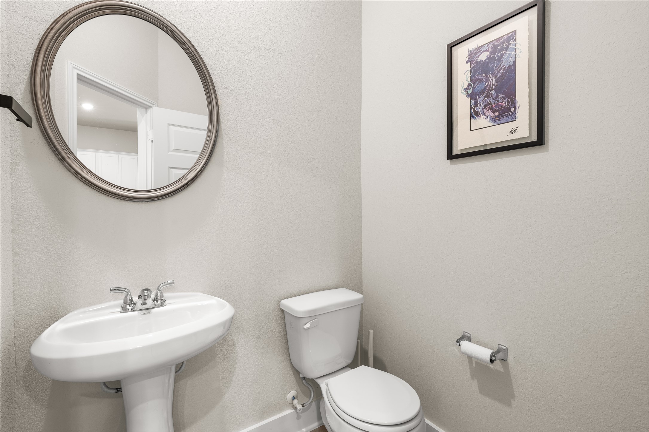 4001 Baja Lane Houston, TX 77045 - Photo 12 of 27 Conveniently located on the first floor, the powder bath allows guests easy access without disrupting the privacy of the home's upstairs living quarters.