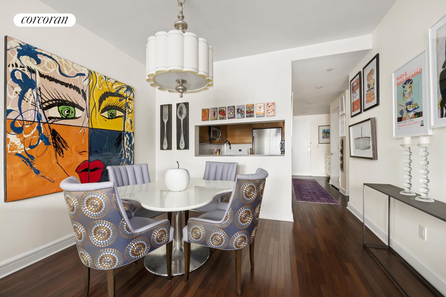 120 Riverside Boulevard, Unit PH1J Manhattan, NY 10069 - Photo 3 of 12 a view of a dining room with furniture and wooden floor
