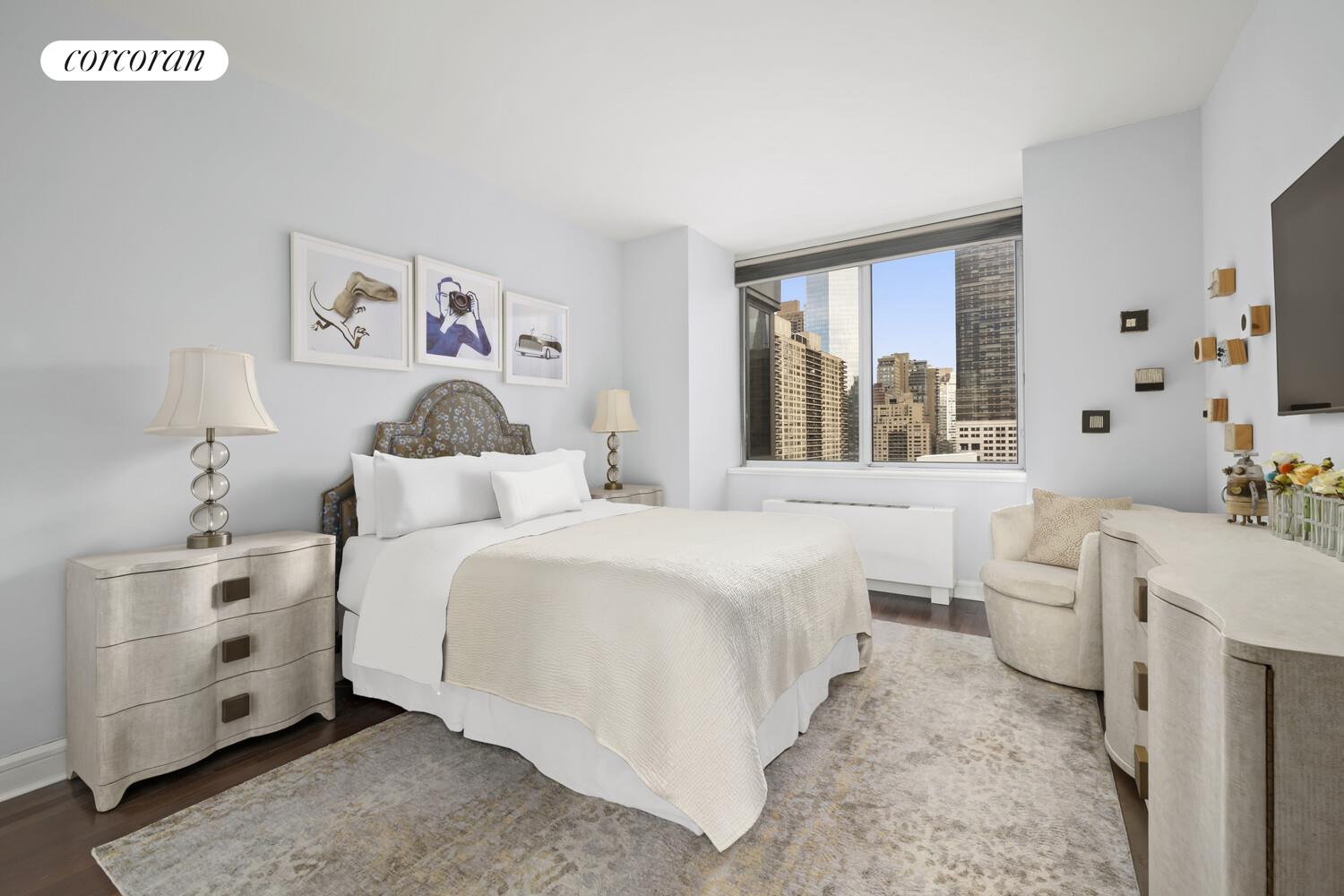 120 Riverside Boulevard, Unit PH1J Manhattan, NY 10069 - Photo 6 of 12 a bedroom with a bed and a large window