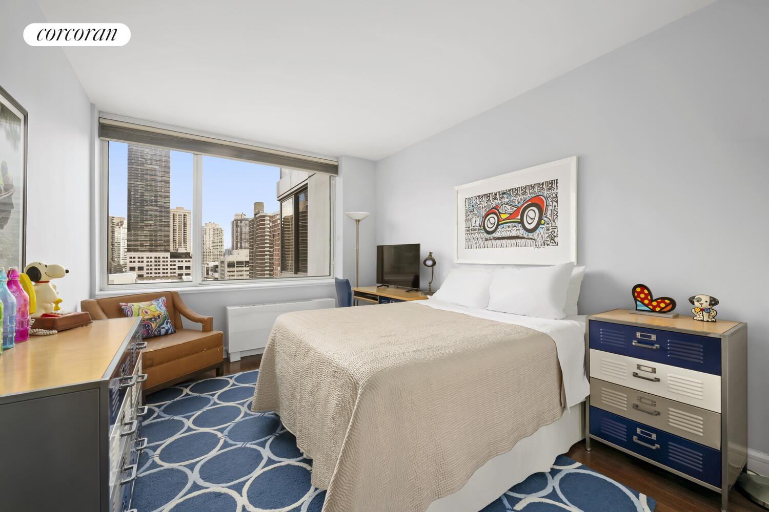 120 Riverside Boulevard, Unit PH1J Manhattan, NY 10069 - Photo 8 of 12 a bedroom with a bed and a large window