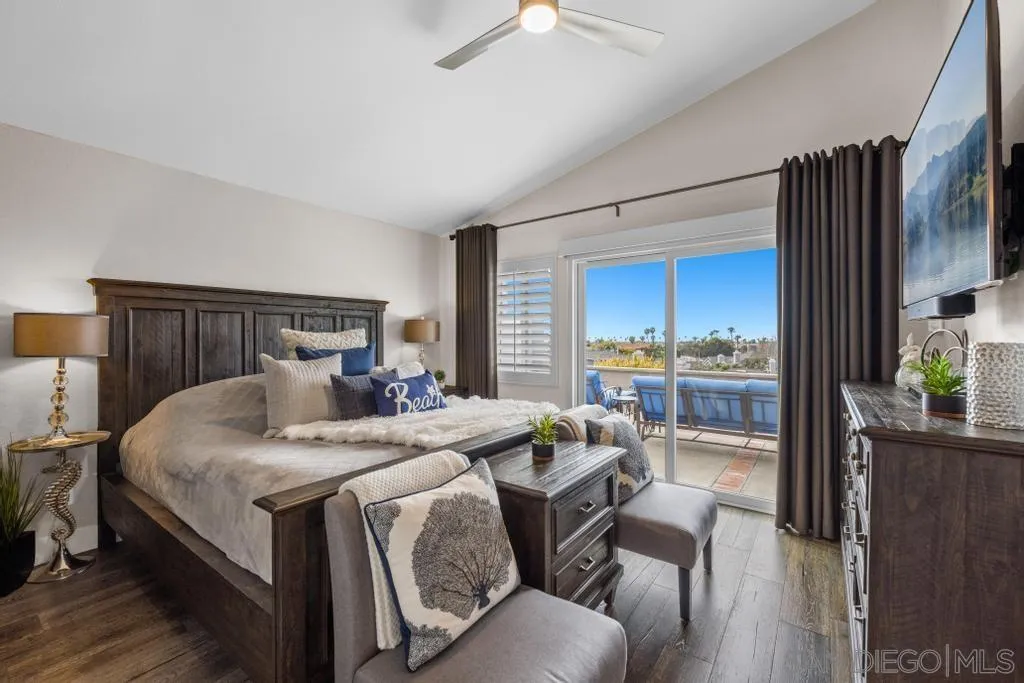 6905 Whitecap Drive Carlsbad, CA 92011 - Photo 32 of 66 a bedroom with a bed and a large window