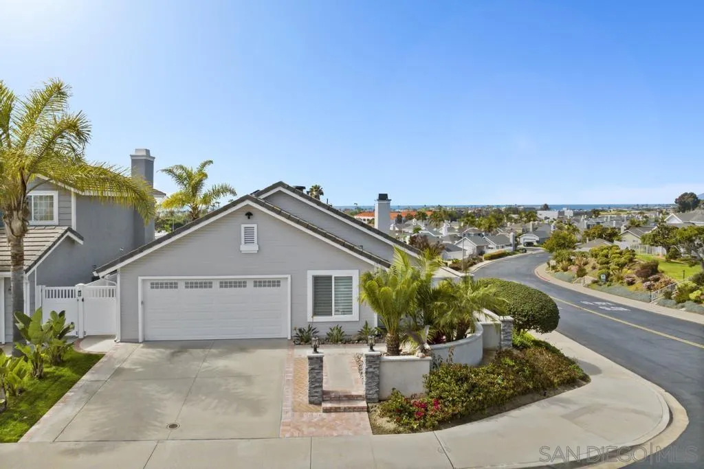 6905 Whitecap Drive Carlsbad, CA 92011 - Photo 53 of 66 a view of a house with a small yard and potted plants