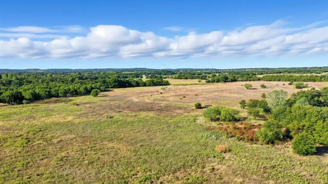 a view of an ocean beach and mountain