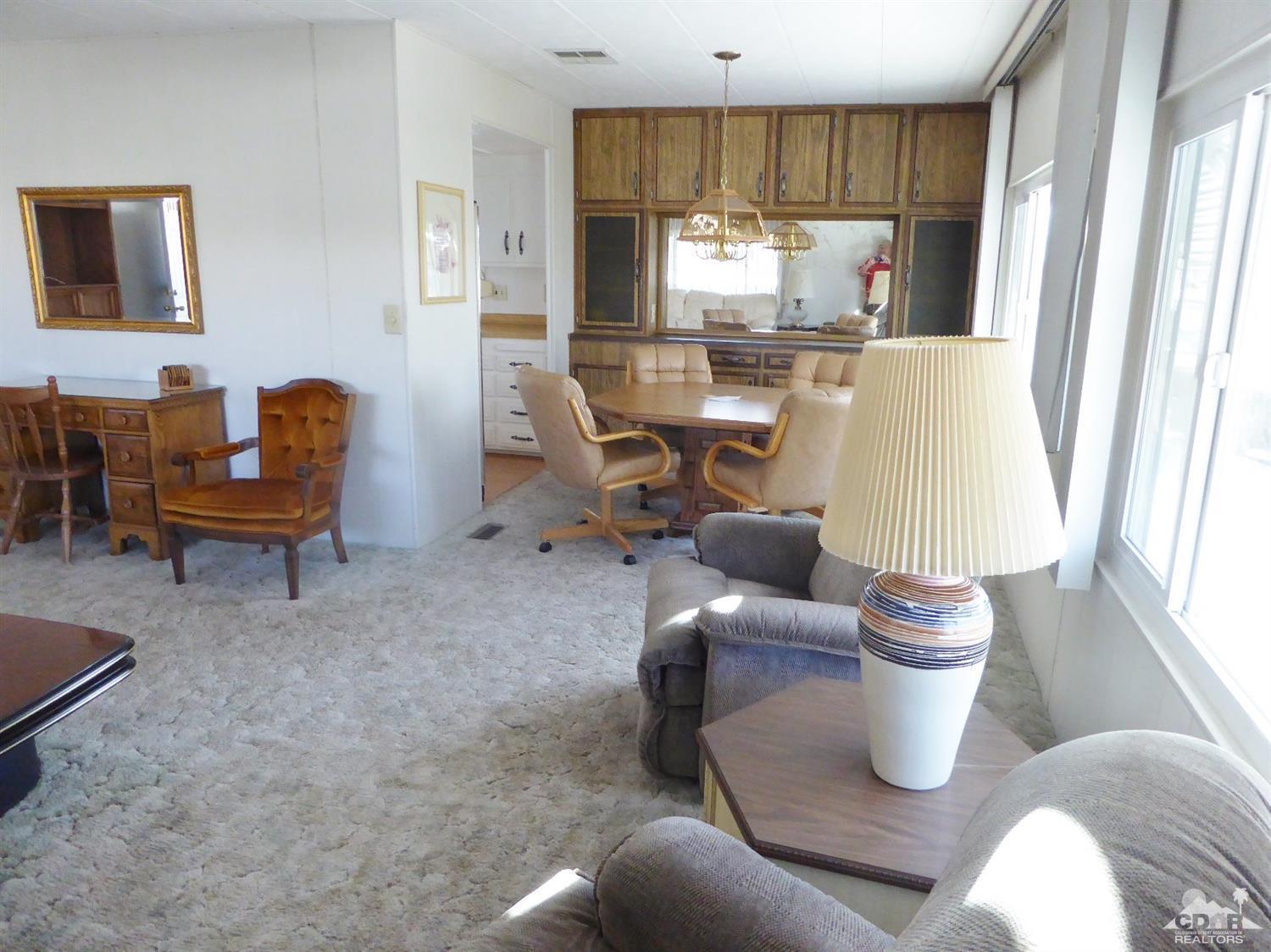 73710 Algonquin Place Thousand Palms, CA 92276 - Photo 6 of 16 a living room with furniture and a window