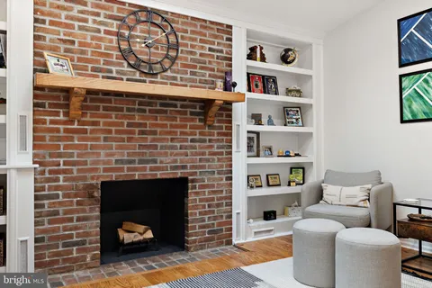a living room with a couch and a fireplace