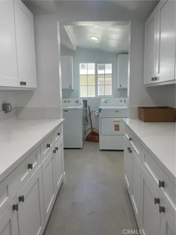 a utility room with cabinets